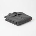 Folded fashion jacket on white background